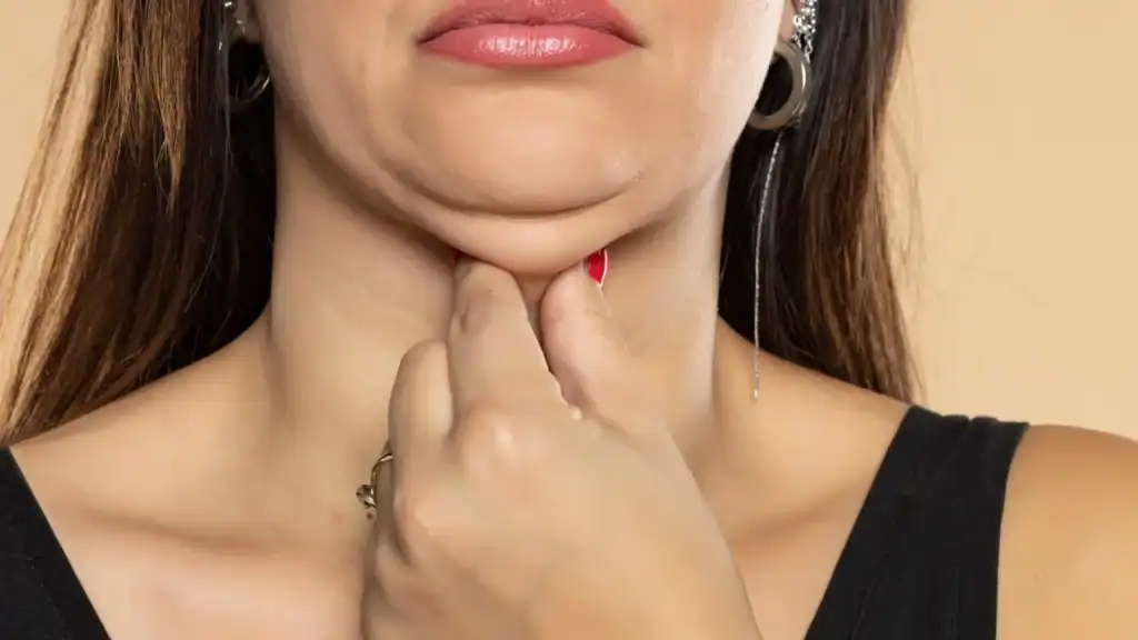 An image of a woman with double chin, sad, worried : Non Surgical Double Chin Removal Treatment in Cheshire, UK